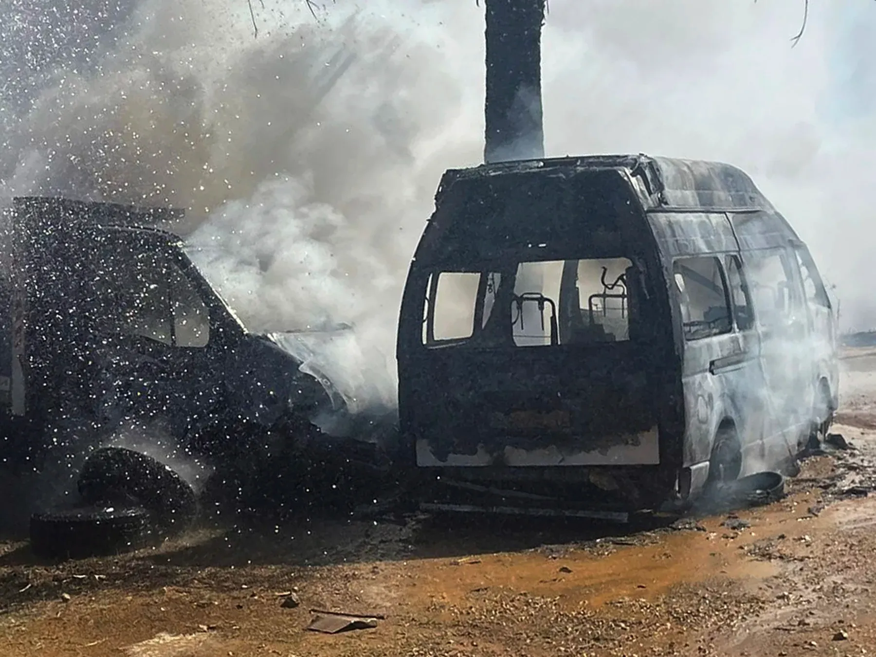 A truck and ambulance burn after Israeli airstrikes hit a group of paramedics outside a hospital in Marjayoun, southern Lebanon, on Oct. 4, 2024.