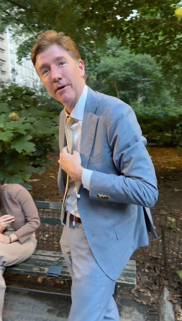 Nathaniel D. Cullerton adjusting his tie.