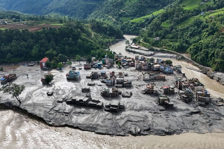 A drone view shows mud covering buildings and property following devastating floods at Trishuli in Nuwakot district, Nepal