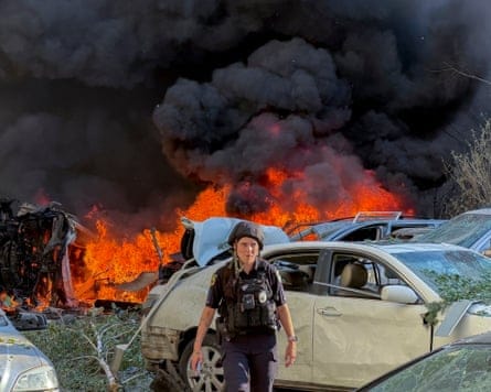 A police officer at the site of the Russian guided bomb attack on a residential area in Zaporizhzhia, Ukraine