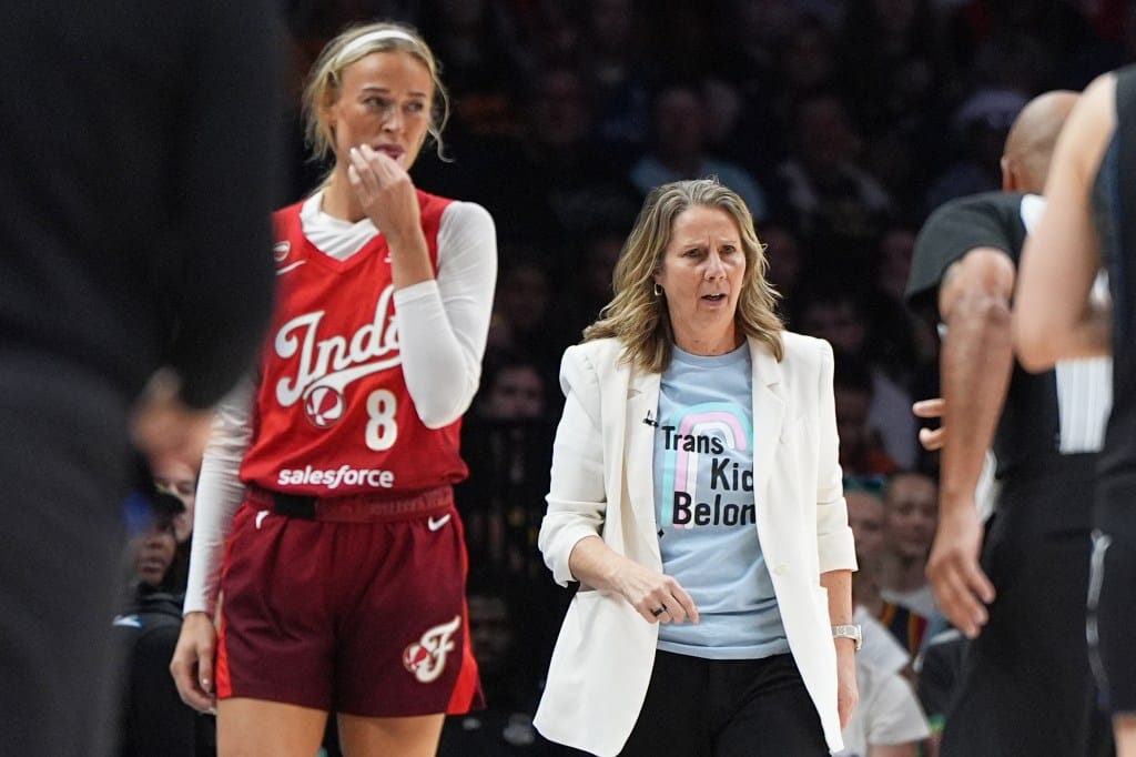 Indiana Fever guard Sophie Cunningham (8) and Minnesota Lynx head coach Cheryl Reeve, right, stand on the court during the first half of a WNBA basketball game Sunday, Aug. 2, 2026, in Minneapolis.
