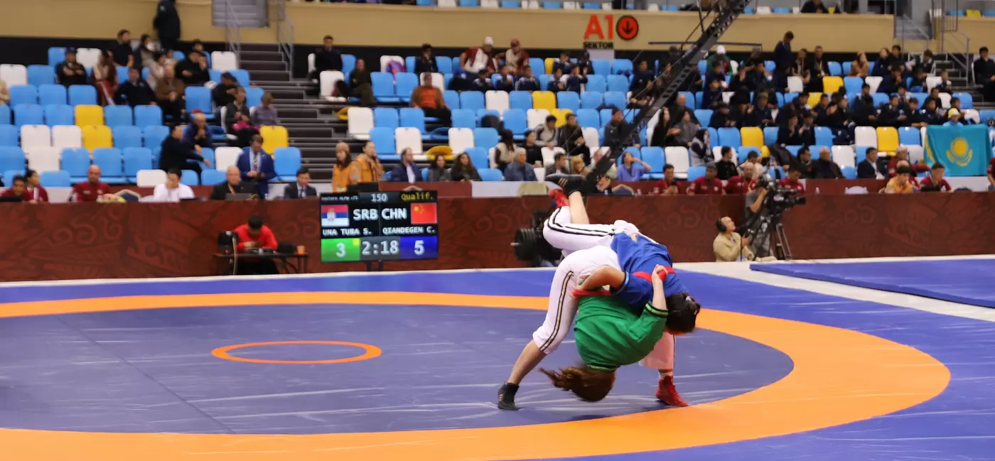 Wrestlers perform in an arena at the World Nomad Games