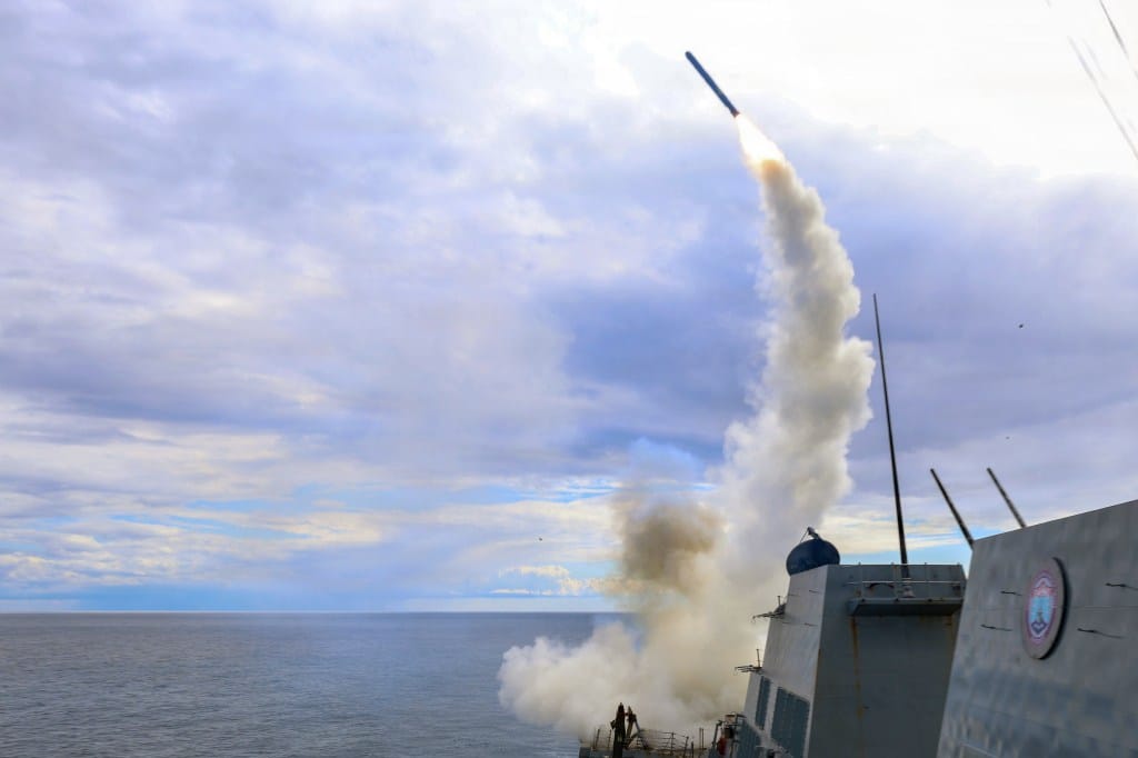 The guided-missile destroyer USS Thomas Hudner fires a Tomahawk land attack missile during Operation Epic Fury.