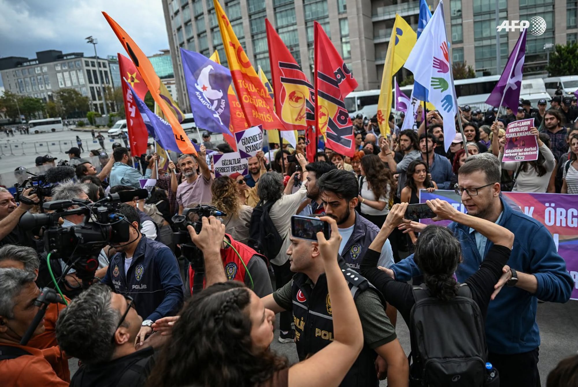 Turkish police push back journalists away from people demonstrating outside Istanbul's courthouse to protest over the arrest and growing targeting of LGBTQ activists, in Istanbul on September 15, 2026.
