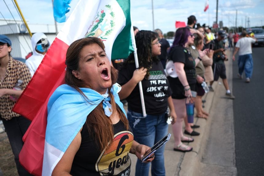 People protest where local authorities say a US Immigration and Customs Enforcement officer shot and wounded a man in Austin, Texas, on September 20.