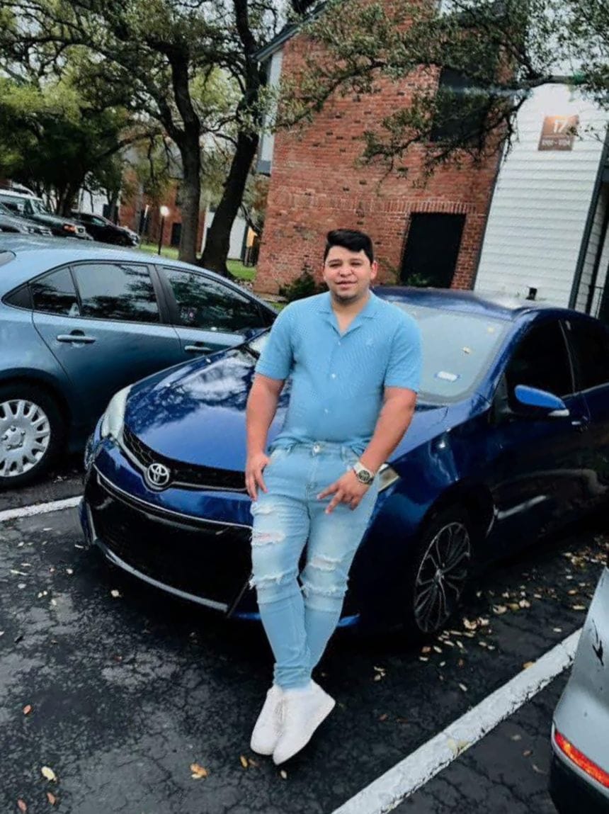 Wilber Rafael Garces Perez, 28, the undocumented man from Venezuela who was shot and injured by an Immigration and Customs Enforcement agent on September 20, is shown standing by his car, which was damaged on the shooting.